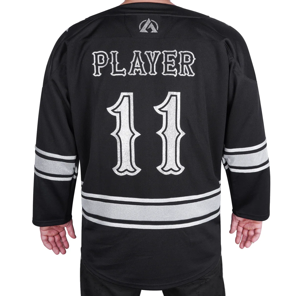 Back of black hockey jersey with silver PLAYER lettering and number 11