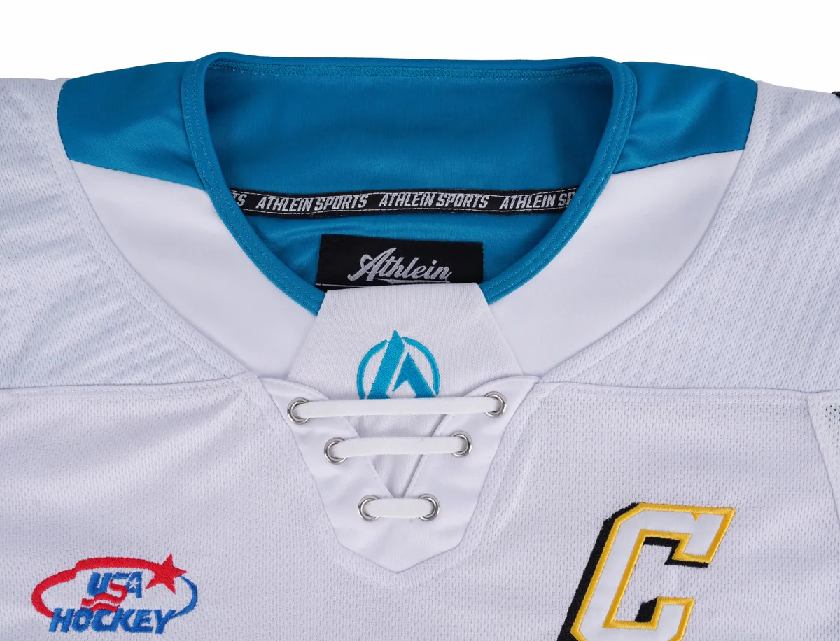Close-up of teal collar, white laces and ATHLEIN SPORTS neck tape and label